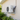 Mini split wall mounting brackets installed on exterior wall supporting a condenser